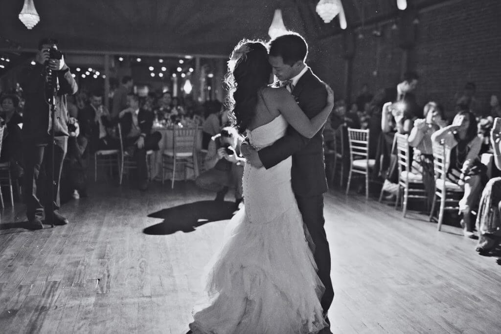 Bride and groom dance black and white.