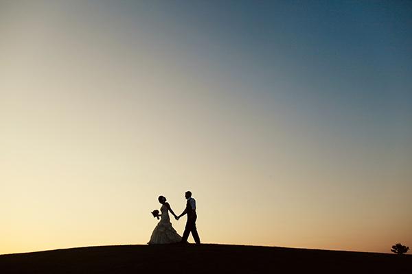 married couple in the sunset