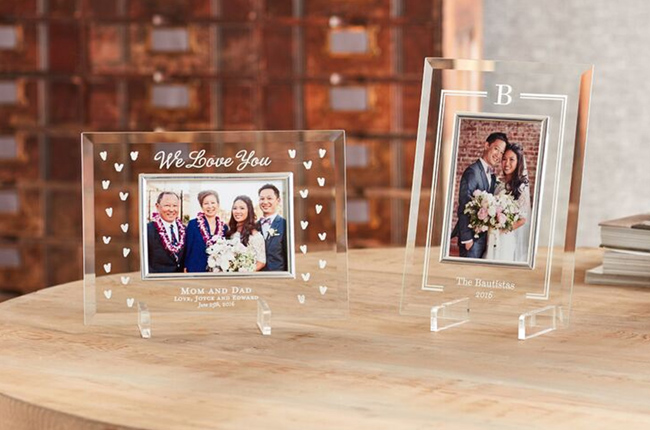 Personalized glass frames featuring a bride and groom posing with family on their wedding day