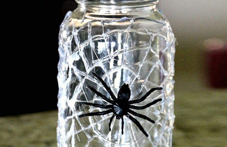 mason jar with spider web design