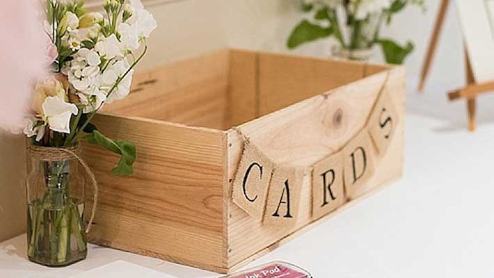 unfinished wood wedding card box with cards bunting banner