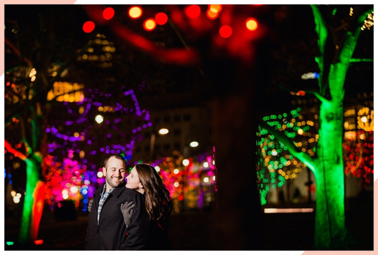 couple tree lights christmas engagement photo
