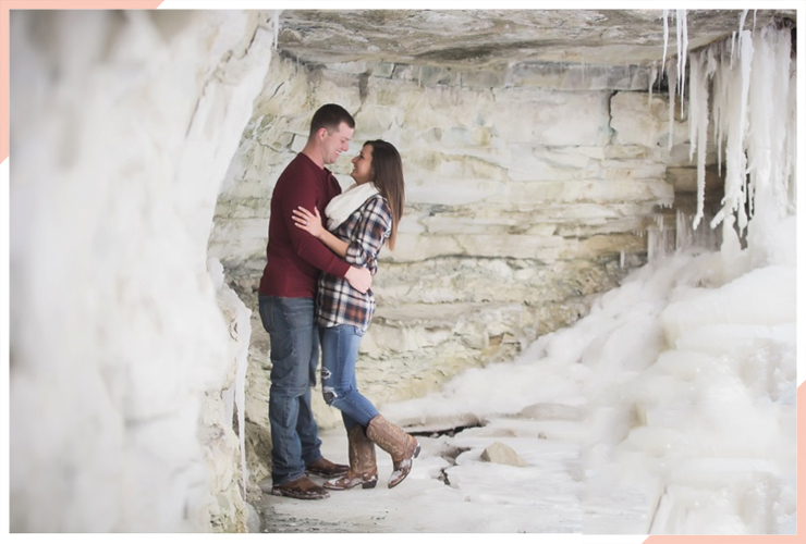 couple in cave christmas engagement photo