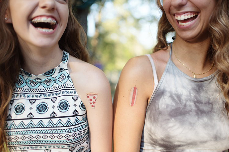 Friends wearing temporary tattoos