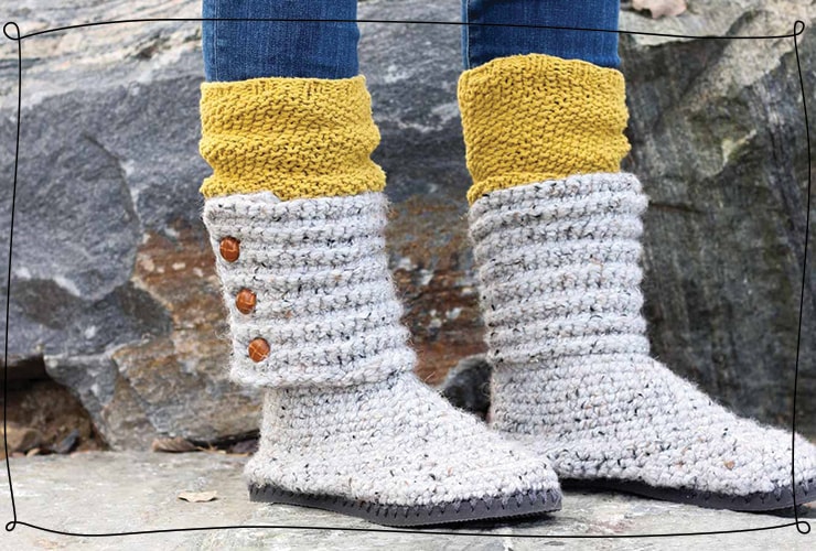Gray crochet boots with brown buttons being worn in winter