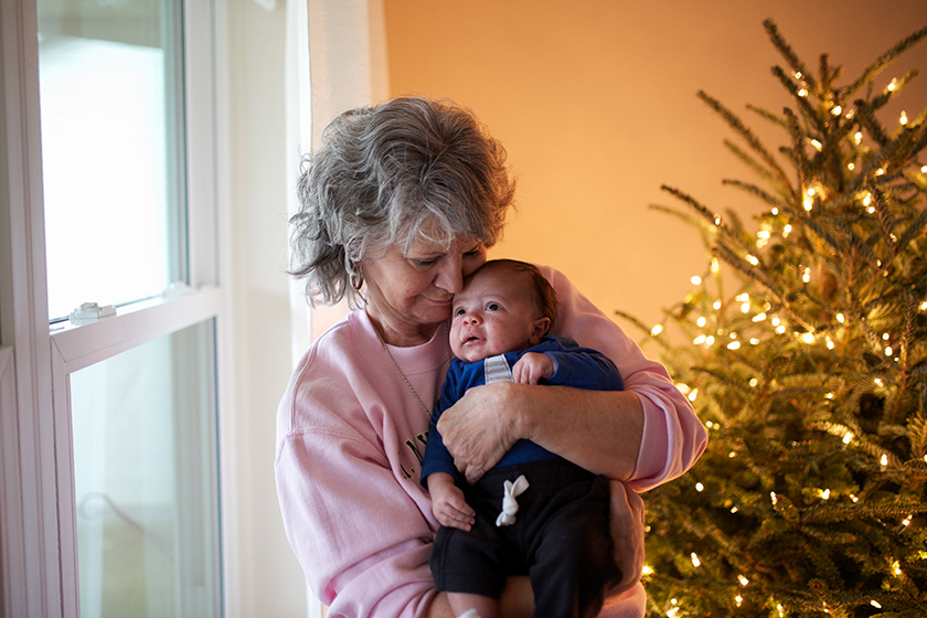 grandma holding newborn baby