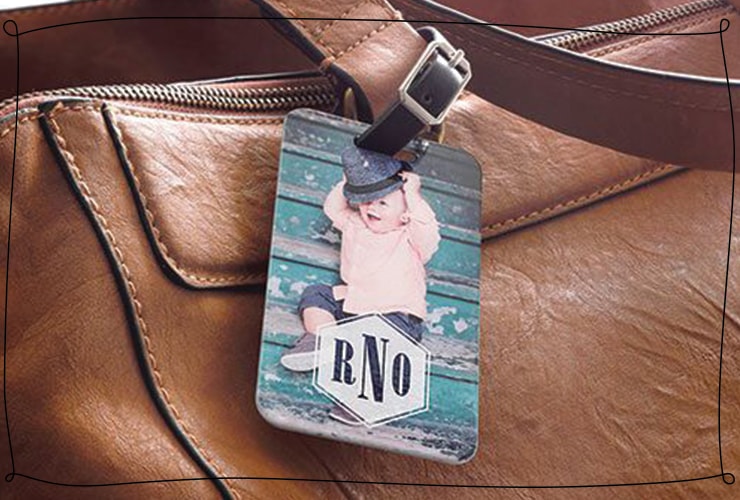 luggage tag with a child on it attached to a brown leather bag