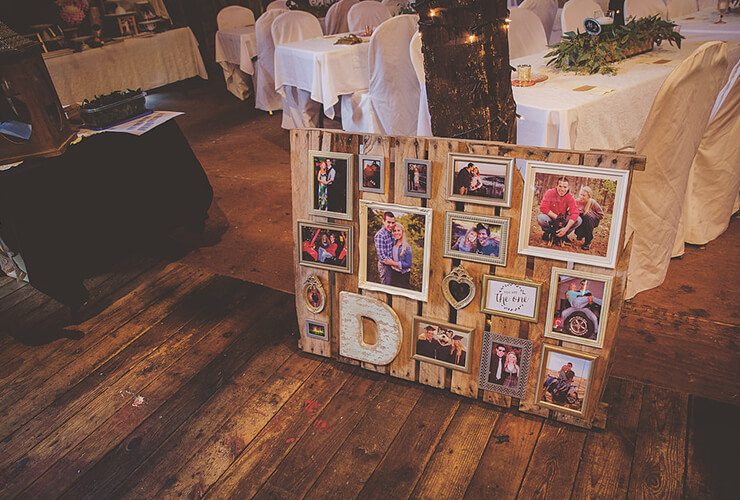 An old wood pallet serves as a photo board 