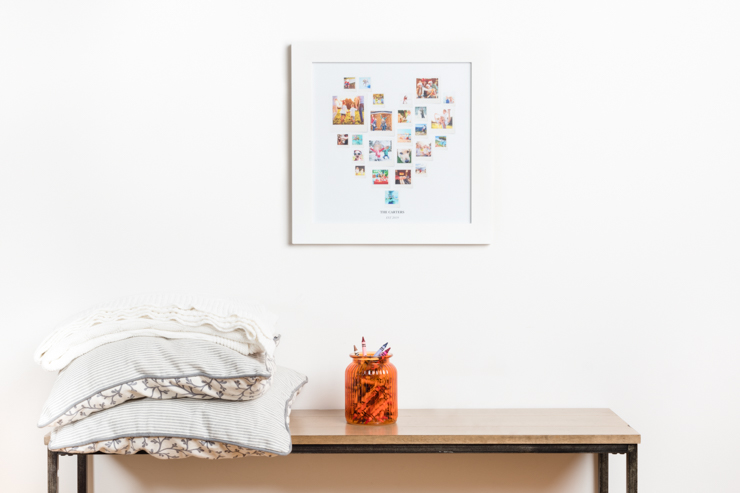 a heart shaped collage above a table with a jar filled with crayons