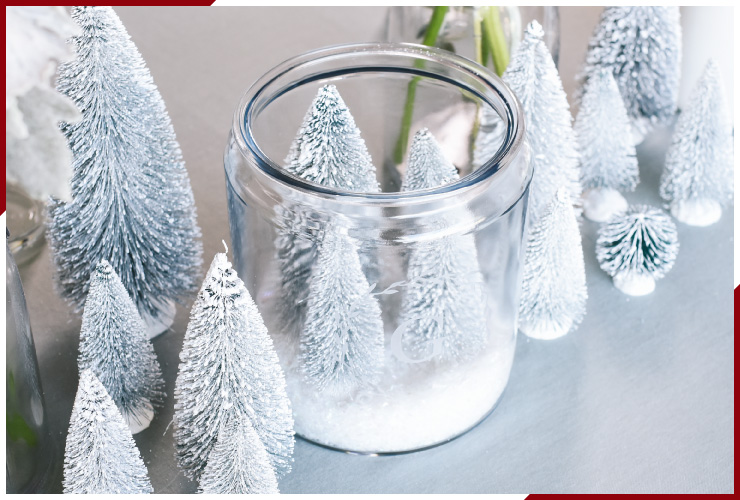 jar filled with white christmas trees