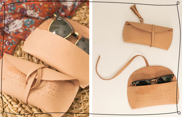 a leather pouch holds sunglasses