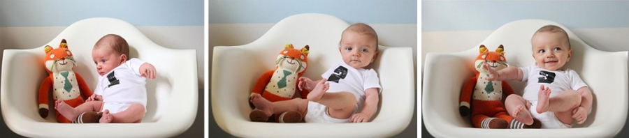 Baby on white chair with stuffed annimal